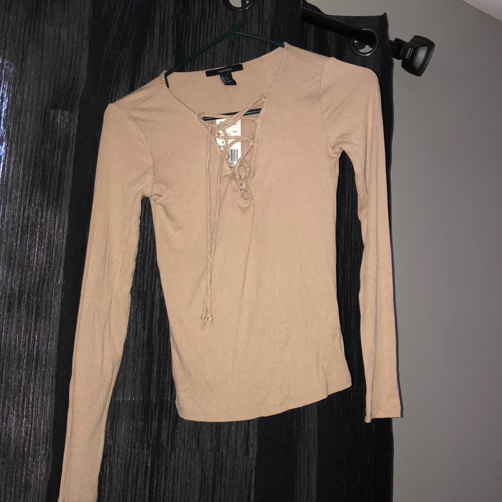 a tan shirt, new with tags